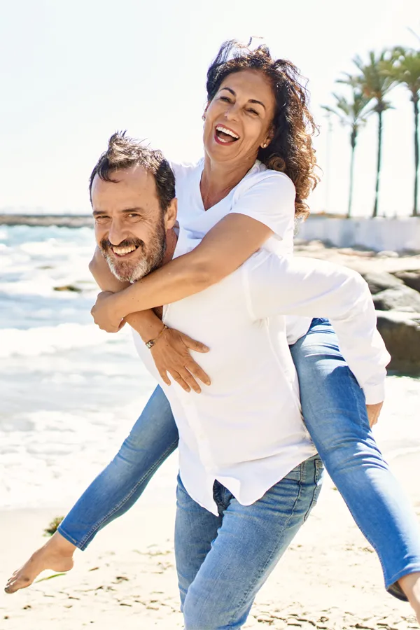 Healthy, energetic couple enjoying an active lifestyle, representing applied kinesiology treatment by Dr. Tasmin Cordie at Sage Functional Medicine in Marlboro Township, NJ.