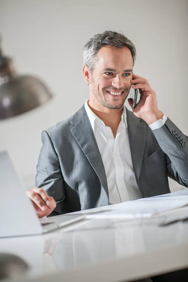 Focus-Issues-Treatment A man takes care of a call at work. Get treatment for focus issues from Tasmin Cordie, D.C. of Sage Functional Medicine in Marlboro Township.