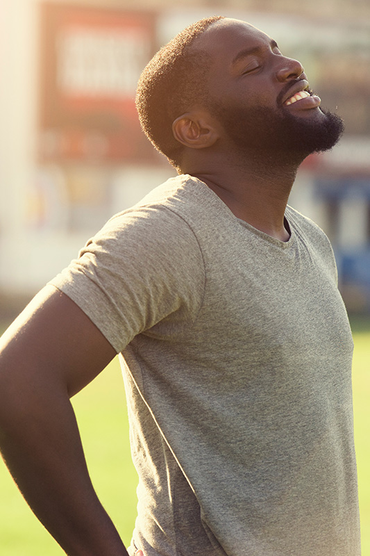 A man smiles and rests after a workout. Get treatment for seasonal allergies from Tasmin Cordie, D.C. of Sage Functional Medicine in Marlboro Township.
