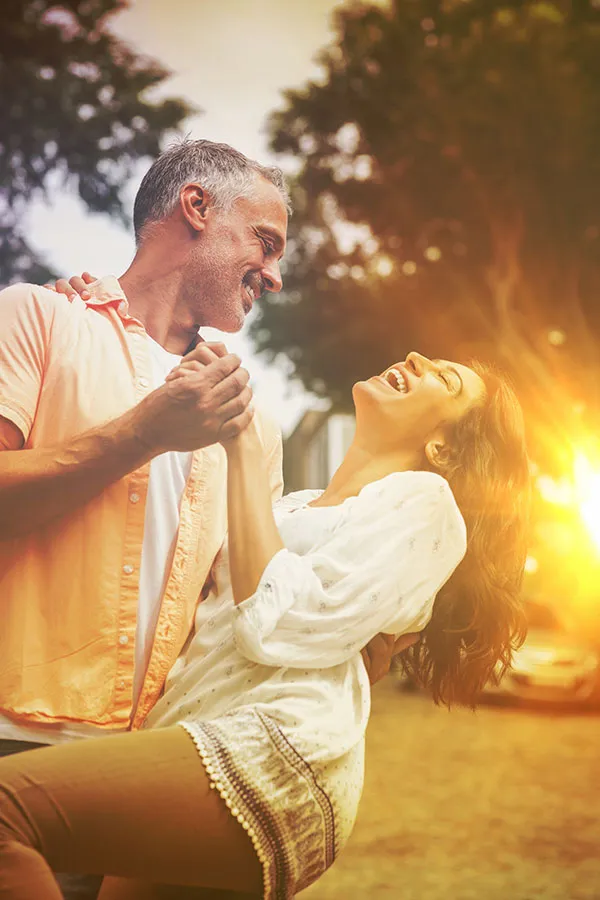 Sexual-Dysfunction-Treatment A mature couple dance in the sunset. Get treatment for sexual dysfunction from Tasmin Cordie, D.C. of Sage Functional Medicine in Marlboro Township.