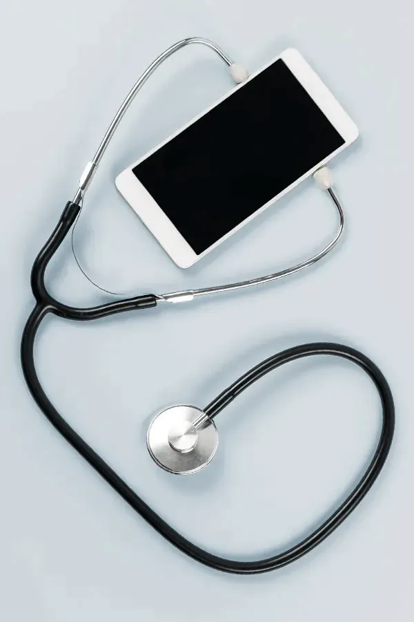 A smartphone with a stethoscope attached to it, symbolizing Telemedicine treatment from Tasmin Cordie, D.C. of Sage Functional Medicine in Marlboro Township.